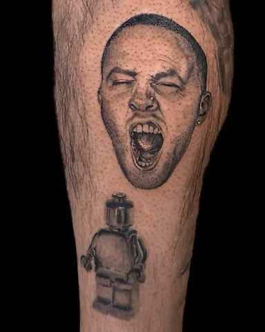 Realistic black and grey Mac Miller portrait from the GO:OD AM album cover calf tattoo, by Domi (based in Coventry, UK)