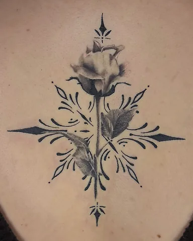 Black and grey rose and ornamental filigree back tattoo, by Domi (based in Coventry, UK)