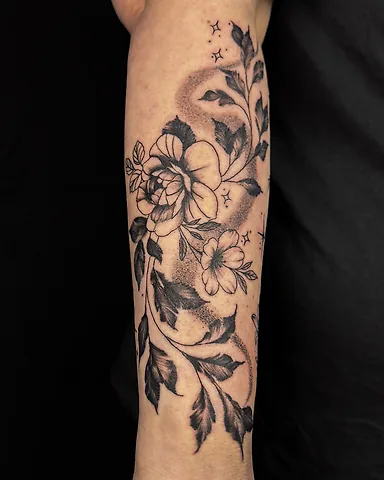 Floral forearm tattoo, by Domi (based in Coventry, UK)