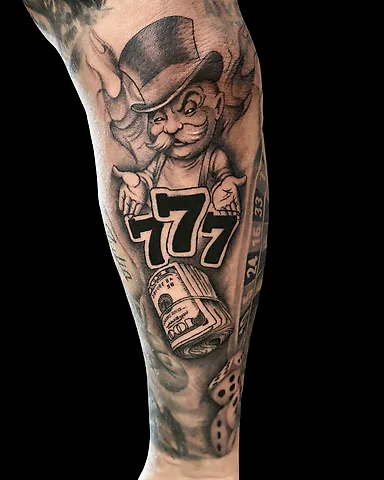 Black and grey gambling-themed Monopoly Man forearm tattoo, by Domi (based in Coventry, UK)